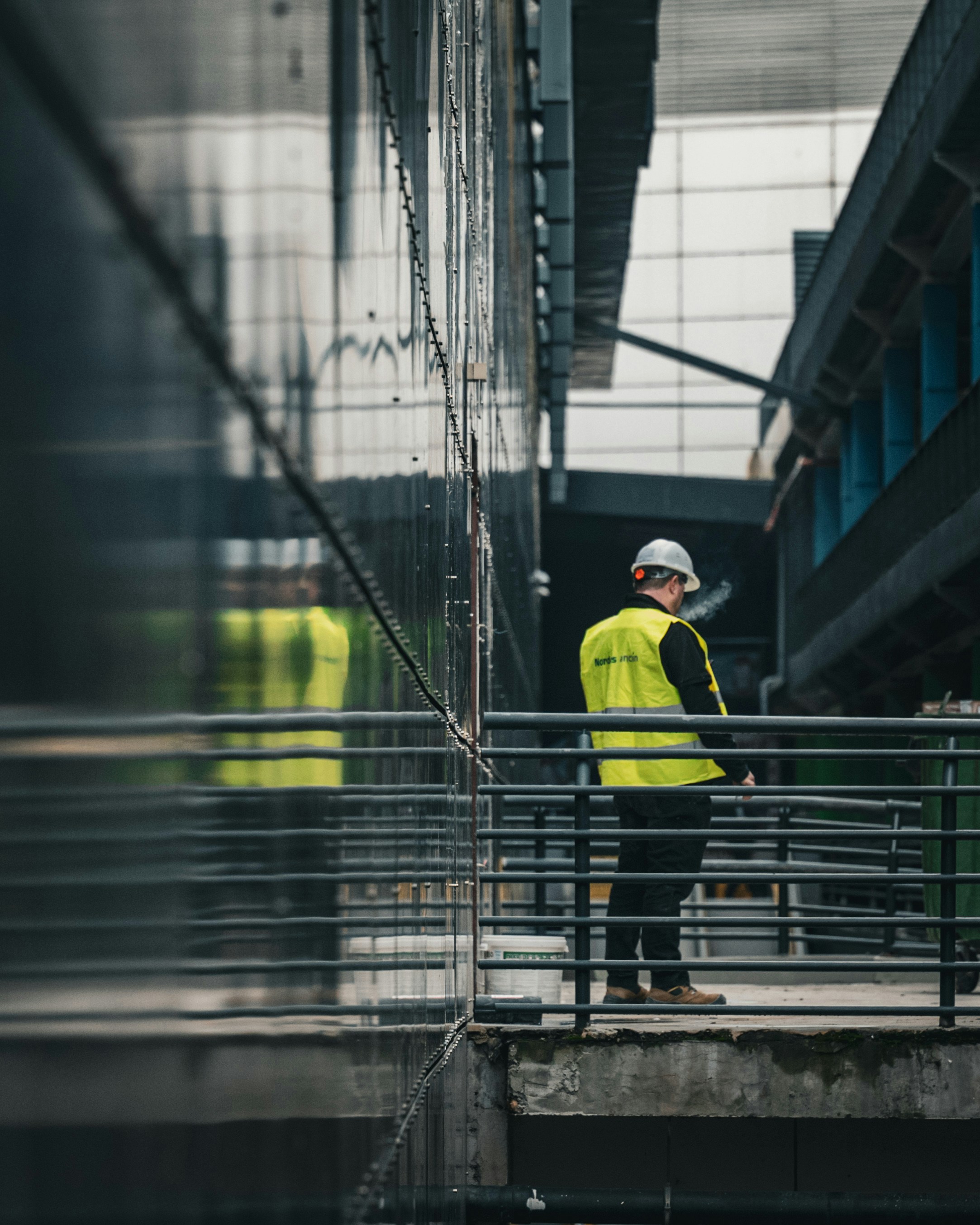 yellow vest, engineer on a bridge structure