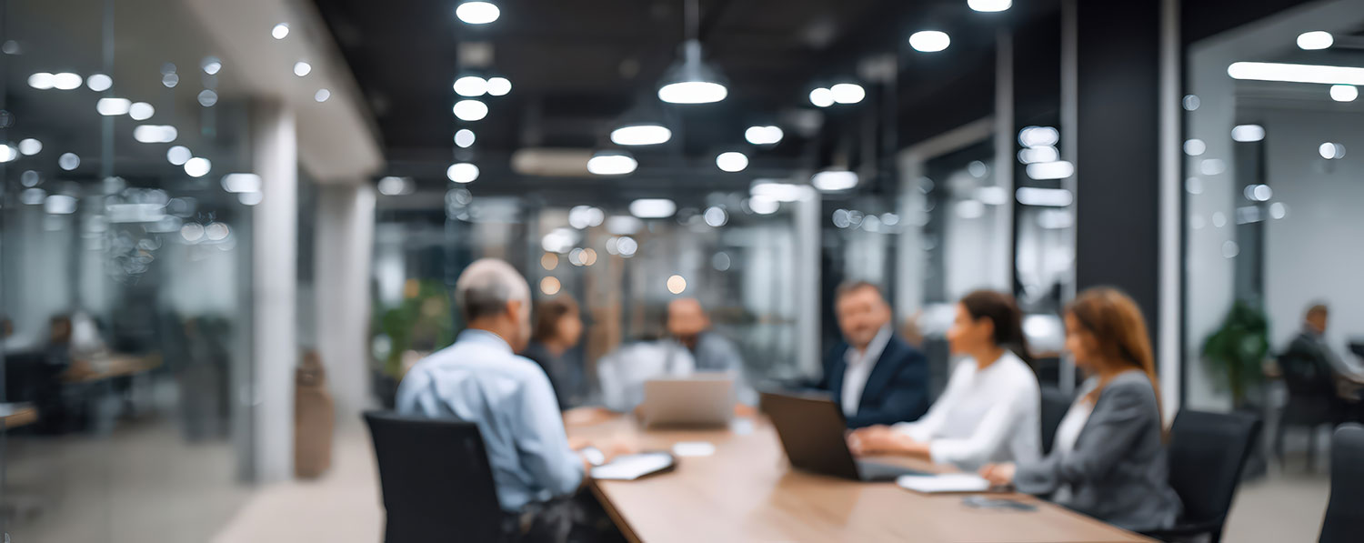 An image of business officials speaking with each other.